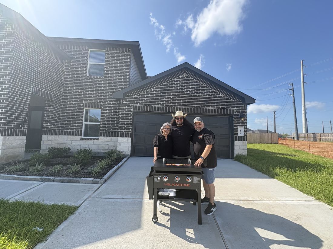 Adrian Arizmendi with clients at their new home