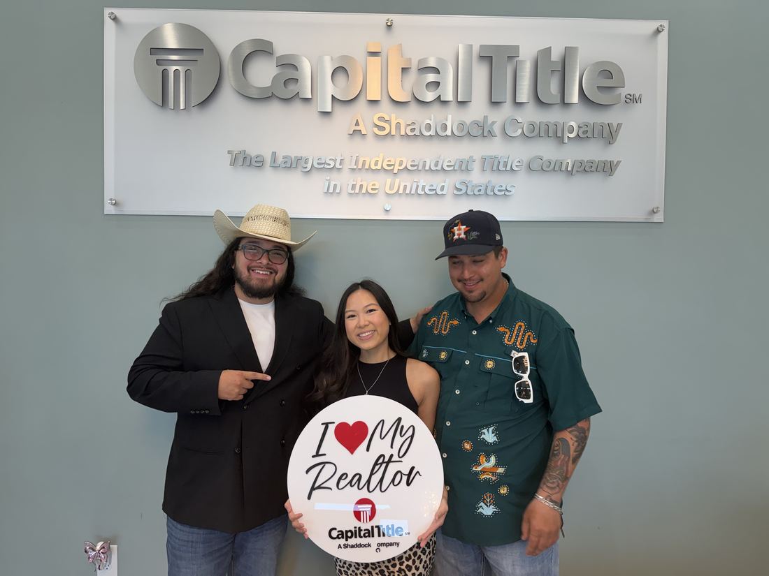 Buyers celebrating a sold home with Adrian Arizmendi