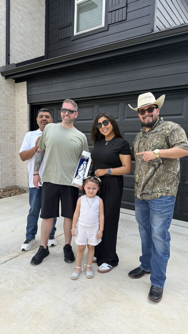 Family at their new home closing with Adrian Arizmendi