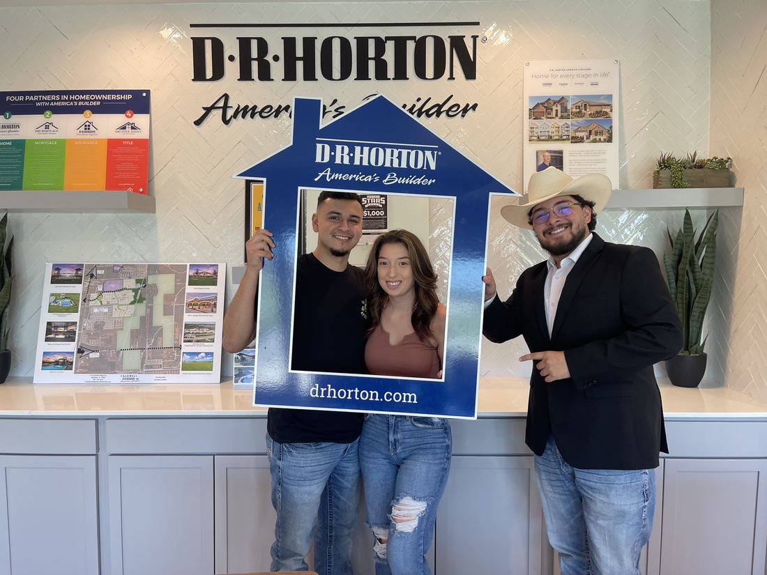 Adrian Arizmendi handing over the keys to new homeowners
