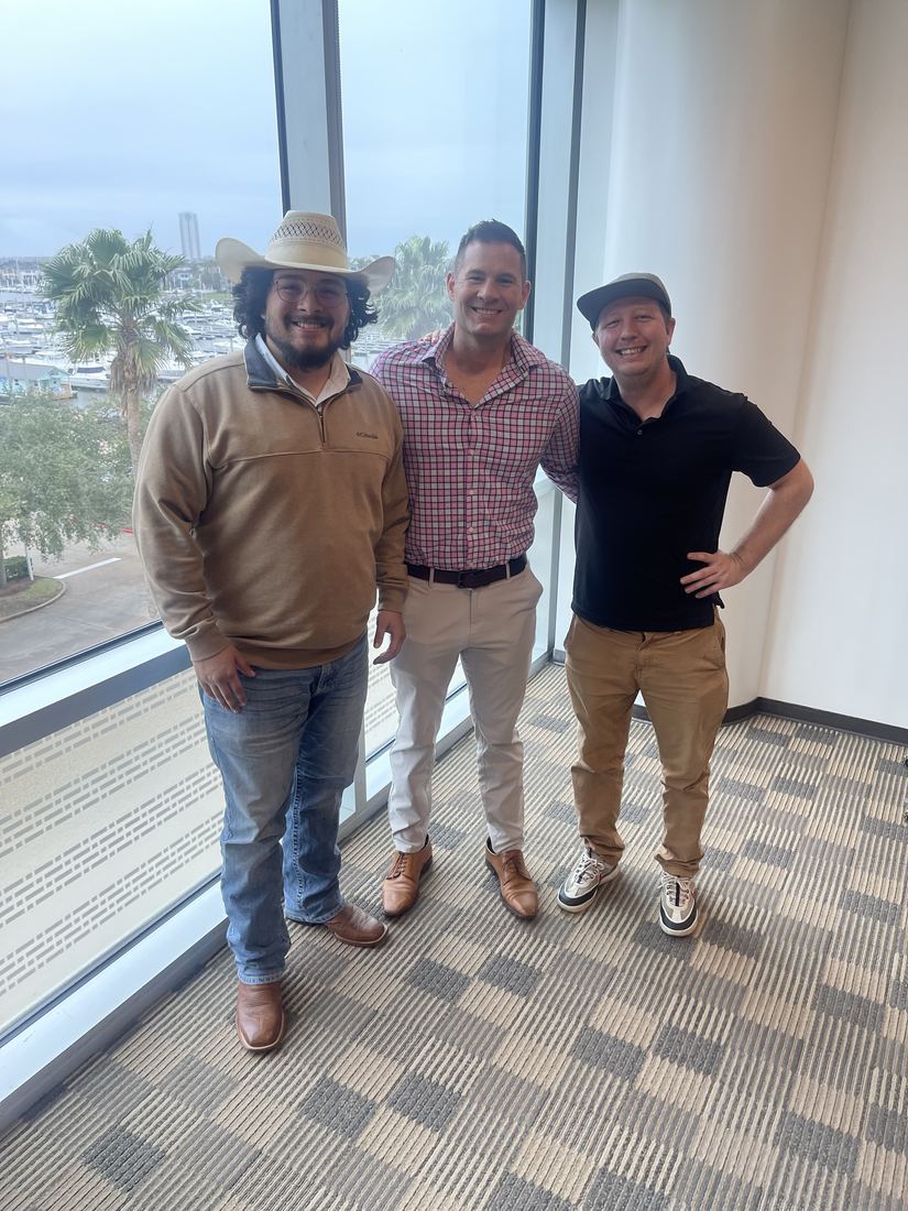 Happy sellers at closing with Adrian Arizmendi