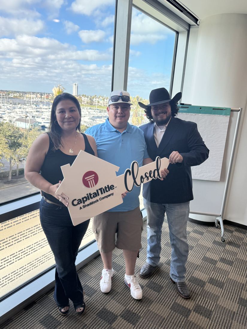 Adrian Arizmendi with happy home sellers